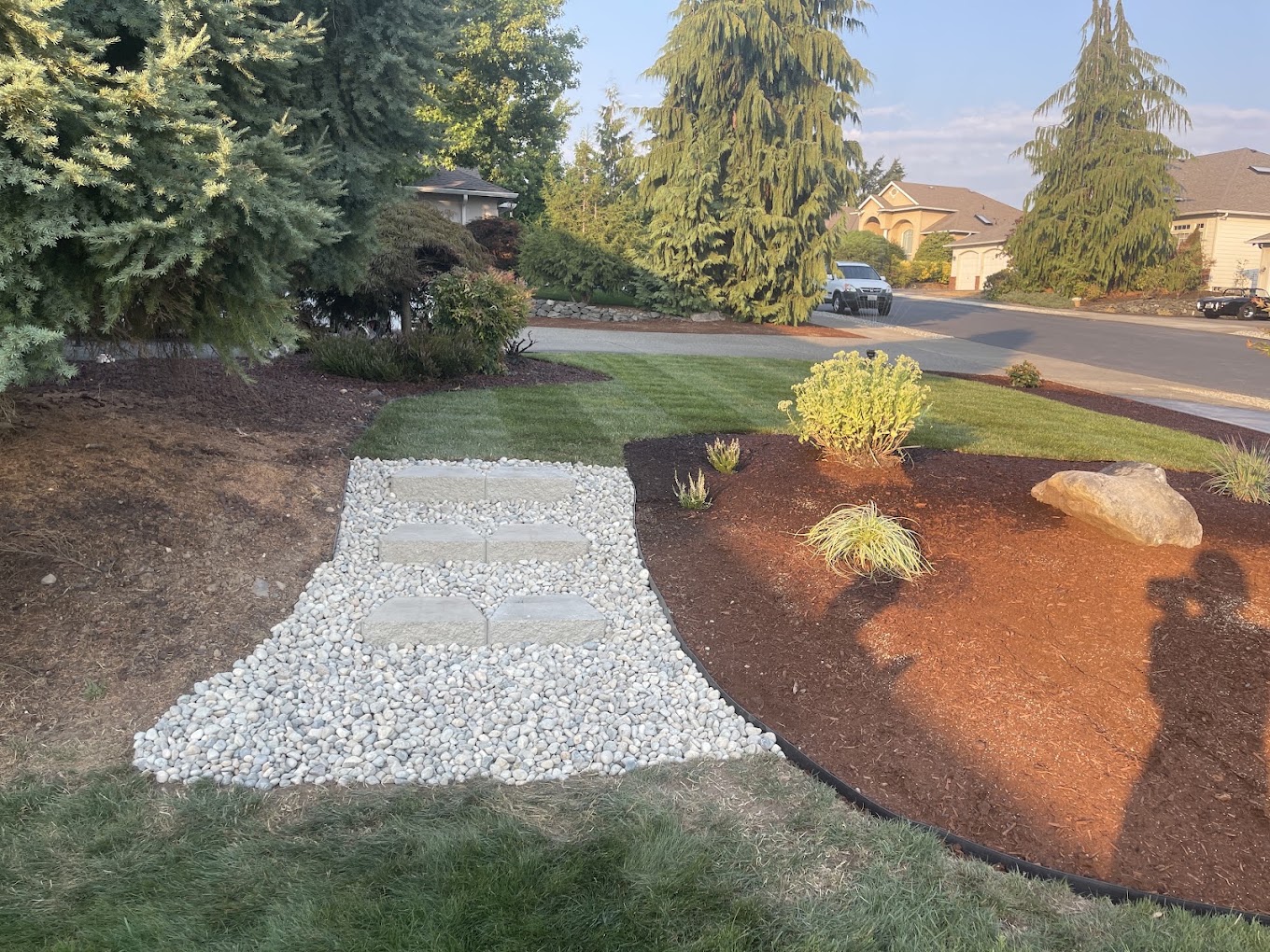 River-rock walkway with paver stones between beds